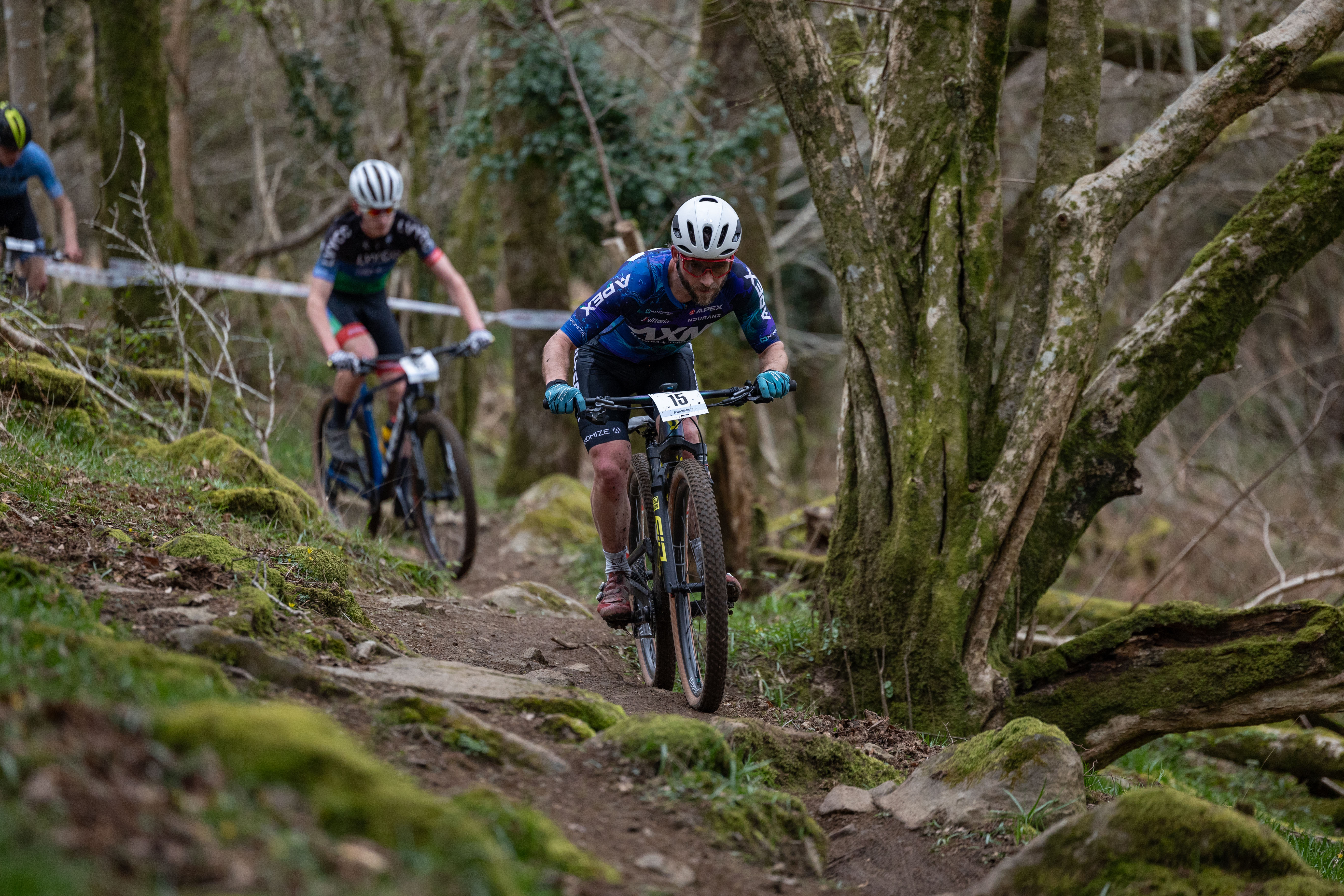 MTB racer on woodland singletrack